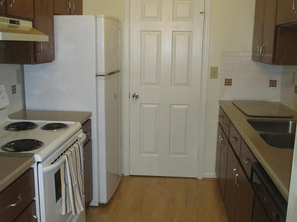 Kitchen and laundry room with storage