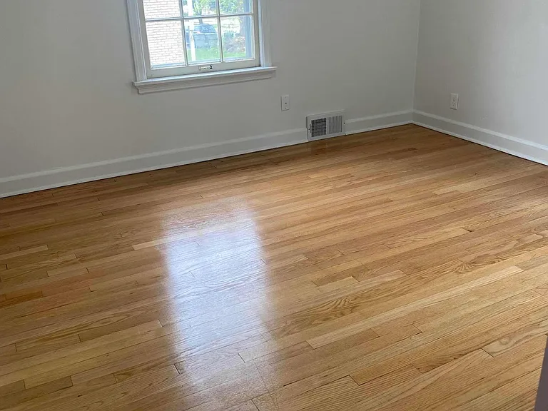 bedroom w/ beautiful hardwood