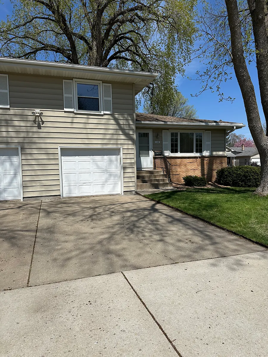 Indoor attached garage with large driveway for extra parking. - 4318 W 126th St #1