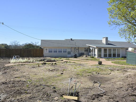 Backyard with view of sunroom. Still have plans for work in yard once weather clears