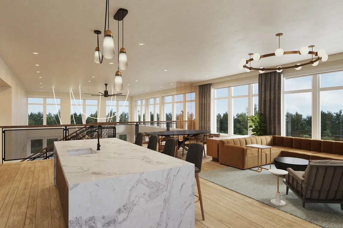 2nd-floor rooftop lounge at Modera Shoreline apartments features a demonstration kitchen, dining area, and comfortable seating.