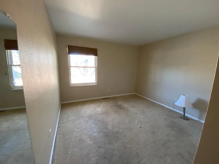 Upstairs bedroom #2, also same with carpet. New bamboo shades recently installed in both rooms.