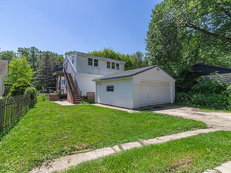 2 garage stalls and parking pad included in rent