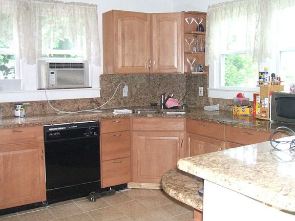kitchen with granite counter tops and backsplashes, ceramic tile floor