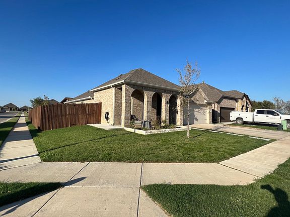 Corner view , concrete pad on other side of fence for golf cart or any other toy