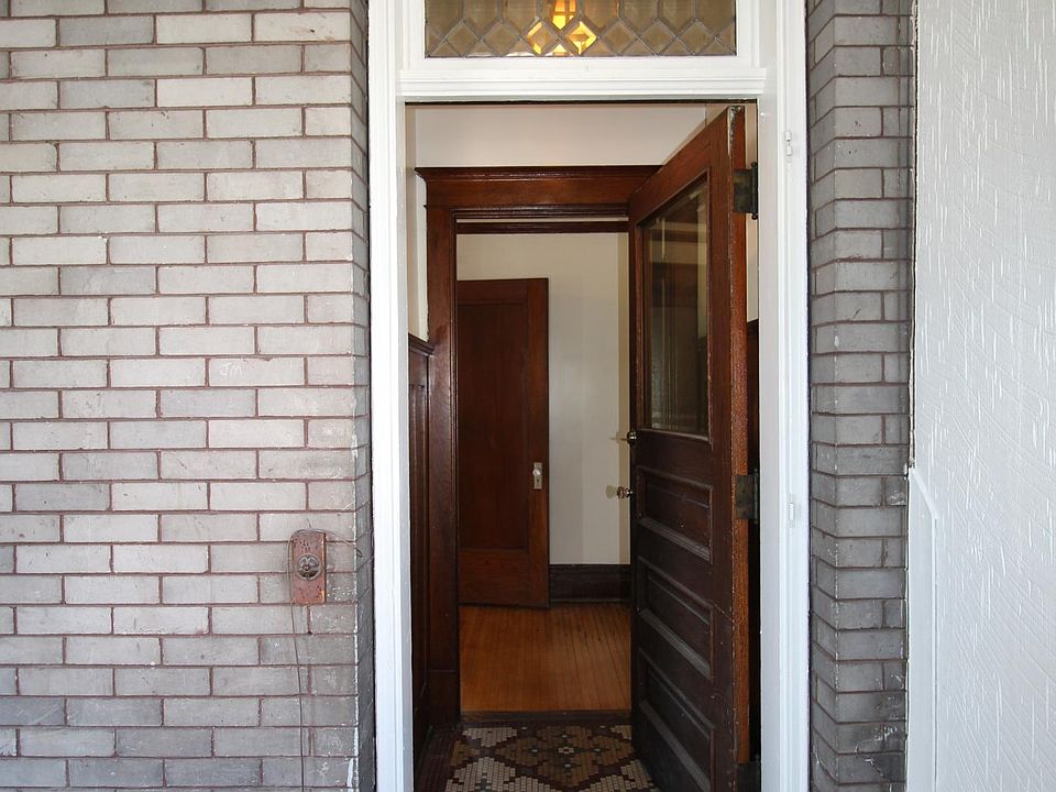 Front door with leaded glass window.