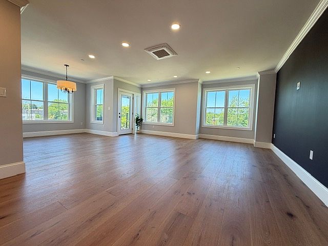 Spacious living spaces with high ceilings & large windows.