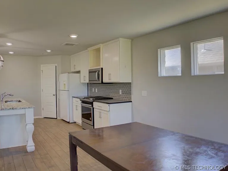 7012 S Elder Ave — Photo 14