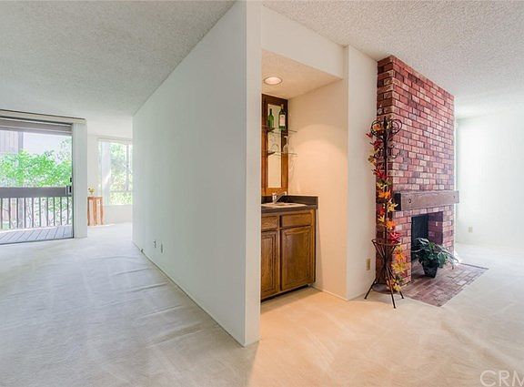 You'll be pleasantly surprised as you walk into this 1 bedroom unit with 1.5 bathrooms, separate living room PLUS den with wet bar.