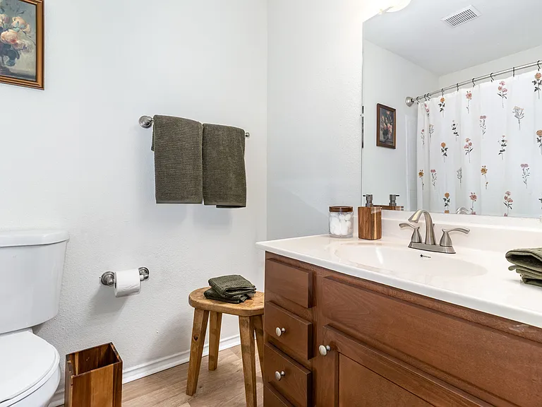Discover a stylish bathroom designed for comfort and convenience, featuring sleek fixtures and tasteful accents.