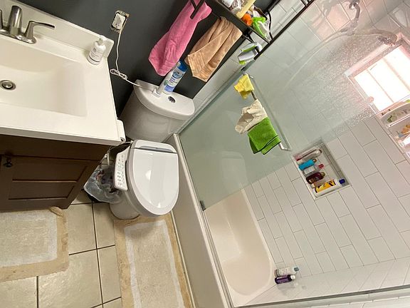 Shared bathroom for bedroom #2 and #3. Newly renovated with brand new shower and vanity.