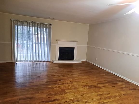 Family room with hardwood flooring and fireplace
