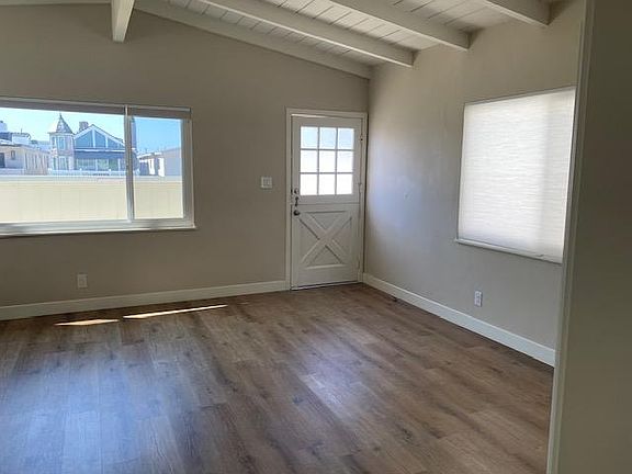 Living area looking out over deck and 30th street.