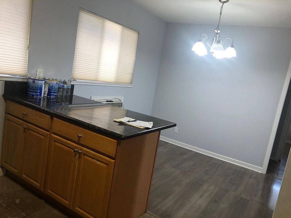 Dining area, kitchen, and living room all flow as one space.