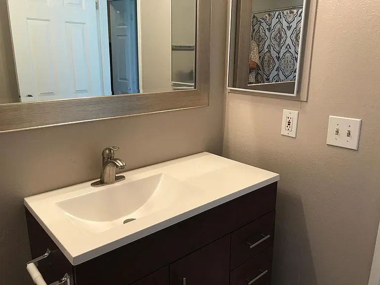 Guest bath with newer vanity.