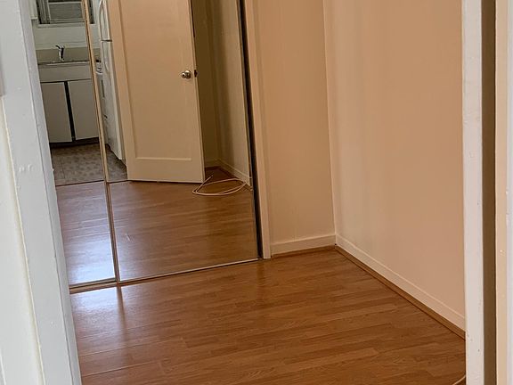 bedroom closet door from kitchen view