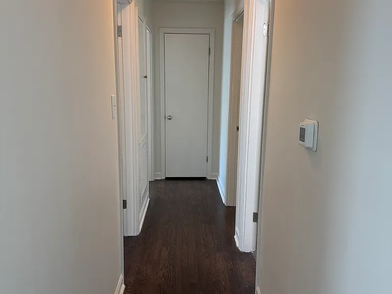 Hallway to bedrooms, bathroom and linen closet at the end of the hall