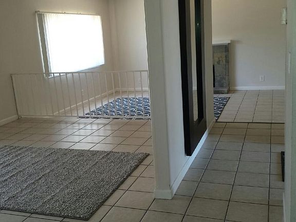 View of formal dining area and living room