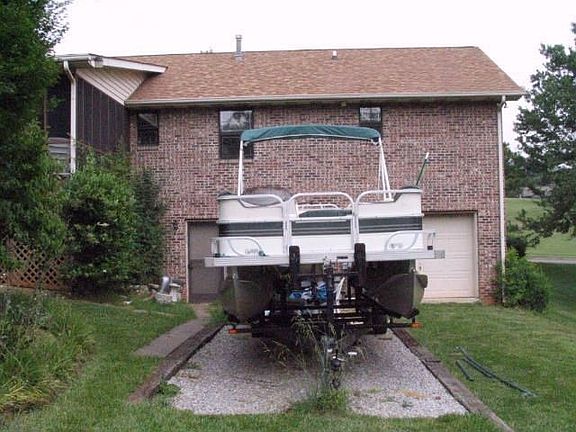 Rear of home, Partial showing Garage door, RV pad and partial porch