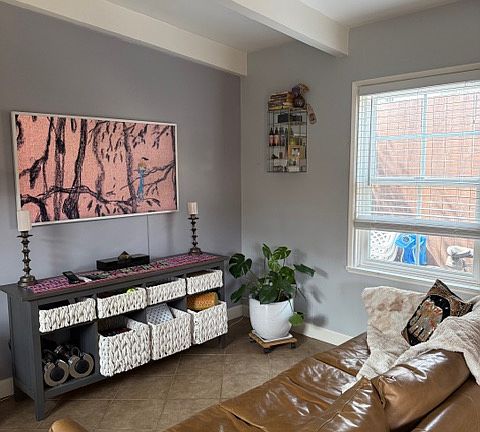 Living room with natural light fireplace and air-conditioning