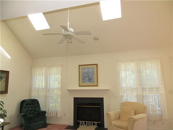 A cozy gas fireplace and skylights
