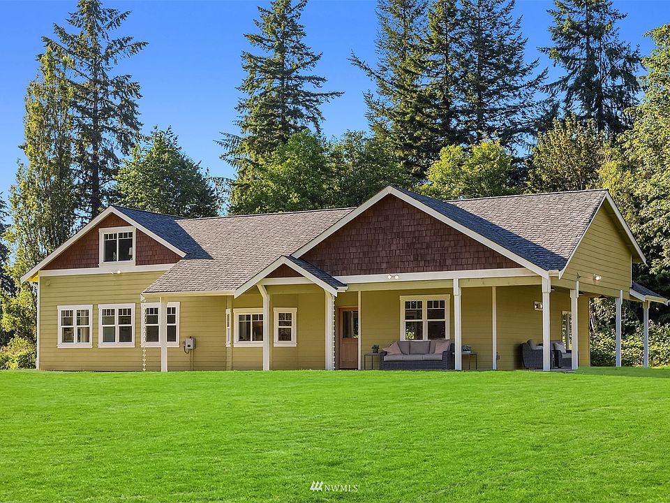 Custom built in 2014. Farm house inspired design with wrap around covered porch.