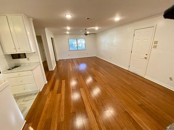 Dining and den near the garage entry. This photo was taken from the patio French doors.