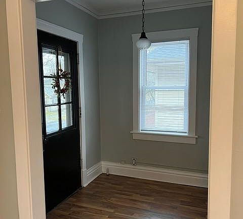 Sunroom with door to balcony
