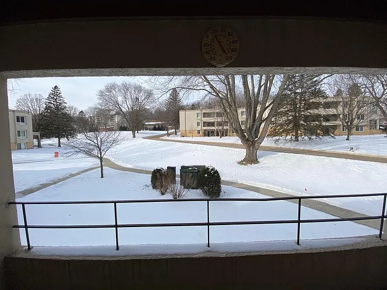 Balcony overlooking the paths leading up to the pools and fitness area