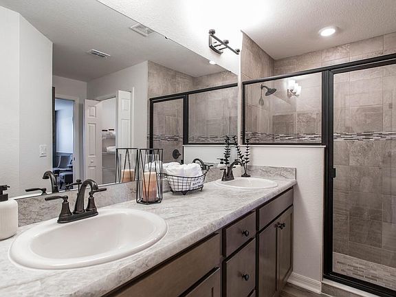 Your suite is complete with this luxurious owners bath - Serendipity home plan by Highland Homes