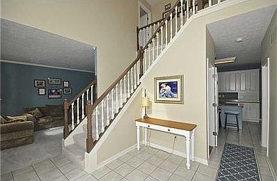 Entry. Dramatic two story entry with stairs leading to the bedrooms