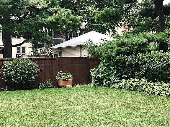 Mature hedges and trees.