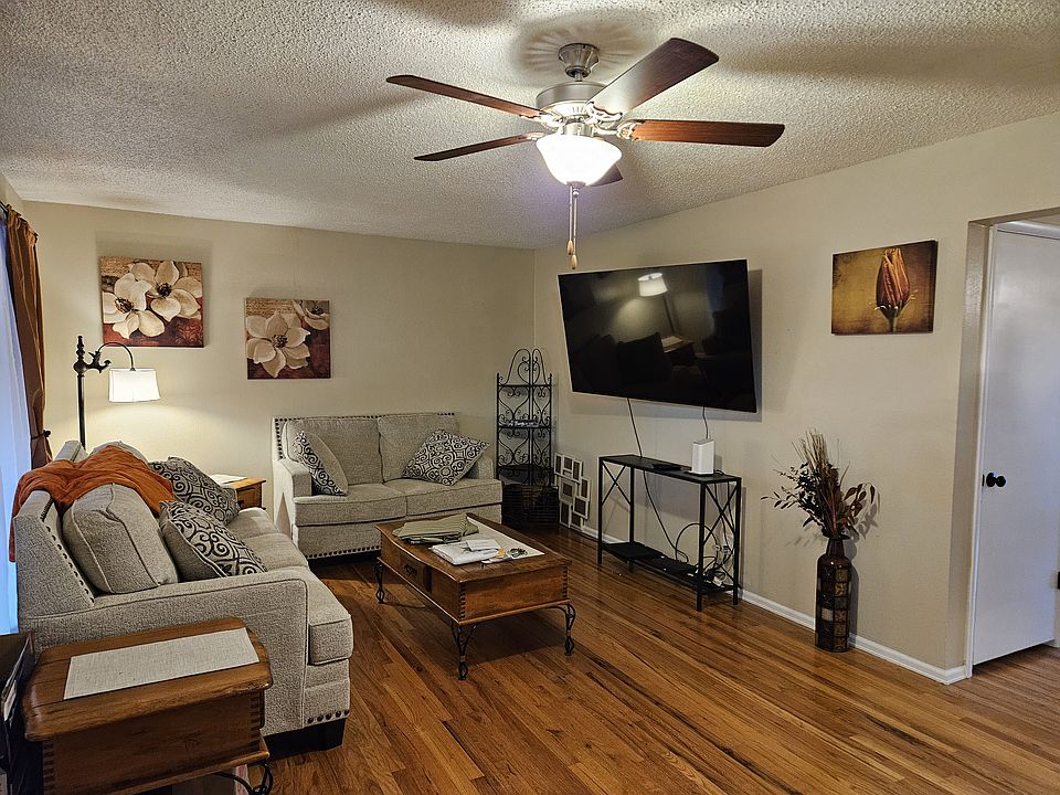 Large adjustable television, beautiful wood floors and new furniture.