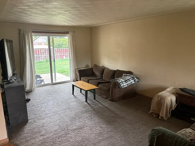 A different view of living room without sliding glass door to backyard.