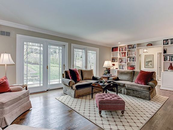 Family Room w/ Beautiful Custom Built-ins and Pella Doors