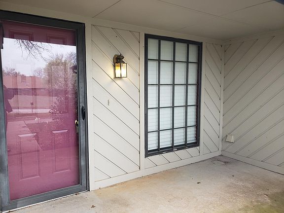 Covered front porch, room for seating, table, etc.