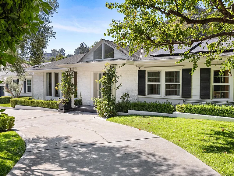 Enter a natural embrace at the front entrance, where the landscaping imparts a refreshing and charming ambiance.
