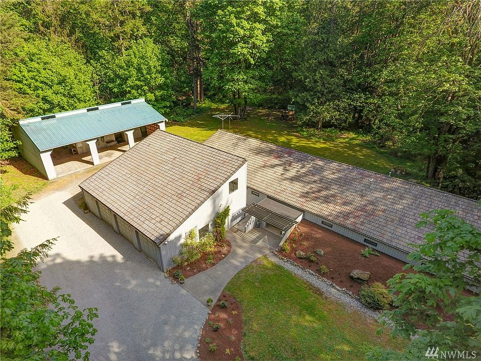 A slice of paradise! Commune with nature in this pristine, quiet, level shy 5-acre property just 6 miles from downtown Redmond &