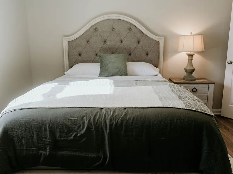 Drift into restful sleep on a brand-new Sealy mattress, complete with blackout curtains and a sound machine for ultimate relaxation