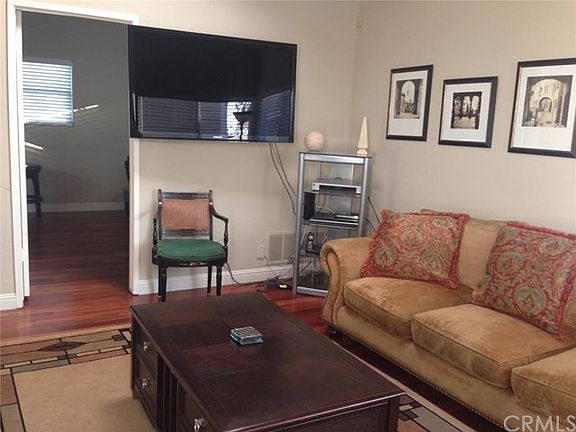 Large living area with high beam ceilings and sky light. Ric