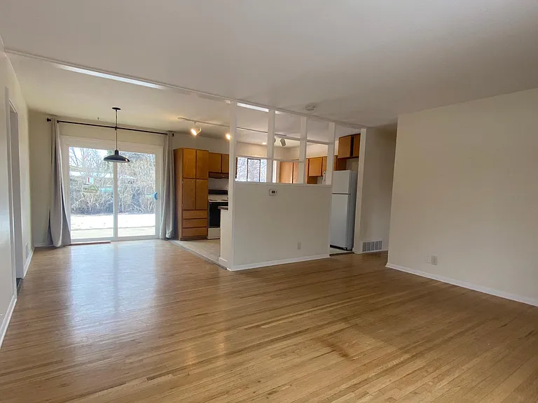 The view from the open plan living room onto dining area and the kitchen