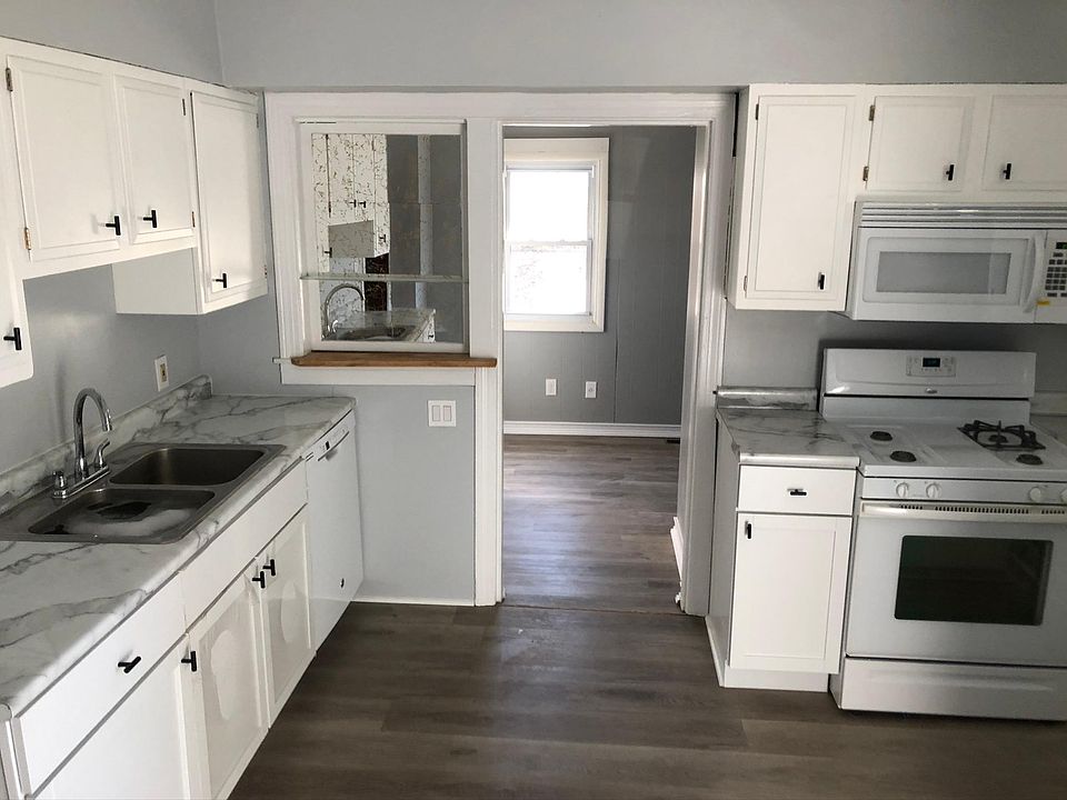 Recently updated kitchen features new cabinets, countertops, and hardwood style flooring. As well as dishwasher, fridge, electric stove and over-the-range microwave.