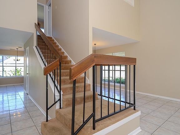 Another look from the entrance door looking towards the breakfast area, upstairs bedrooms and formal dining room.