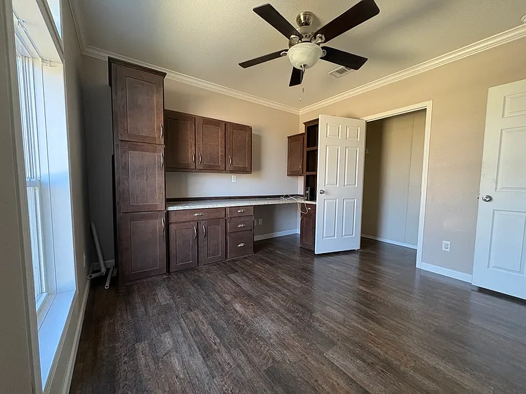 bedroom 4 with built in shelves, can be used as an office