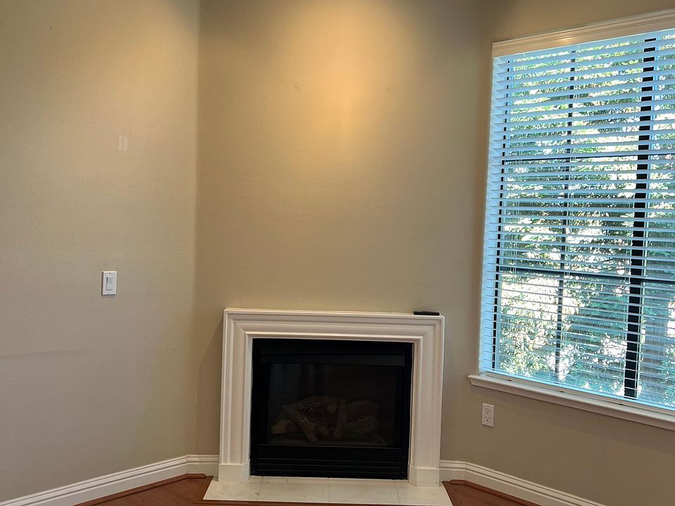 Fireplace located in living room.