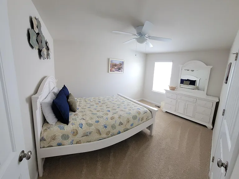 Bedroom #3 features a queen bed and walk-in closet