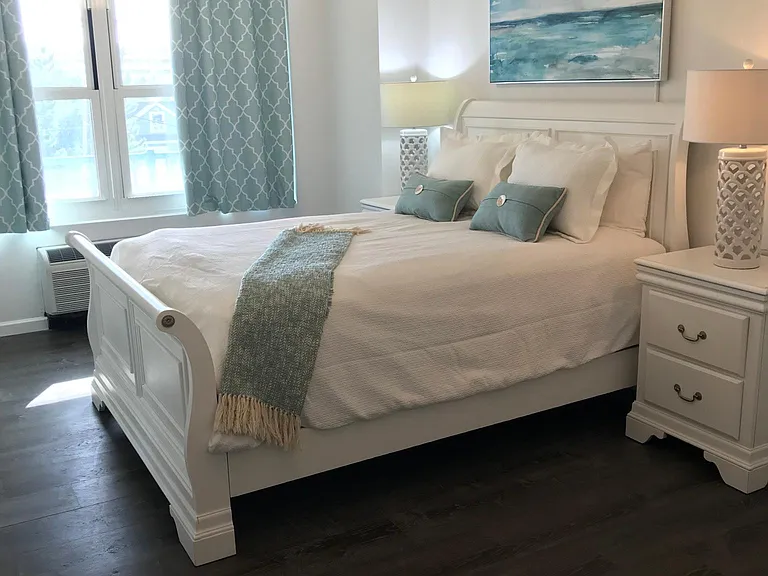 Large furnished master bedroom with ocean views and large closet