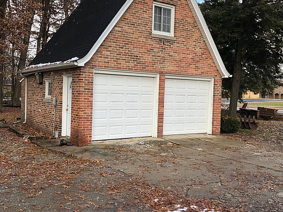 Unattached garage with safe temperature controlled storage at back of garage.