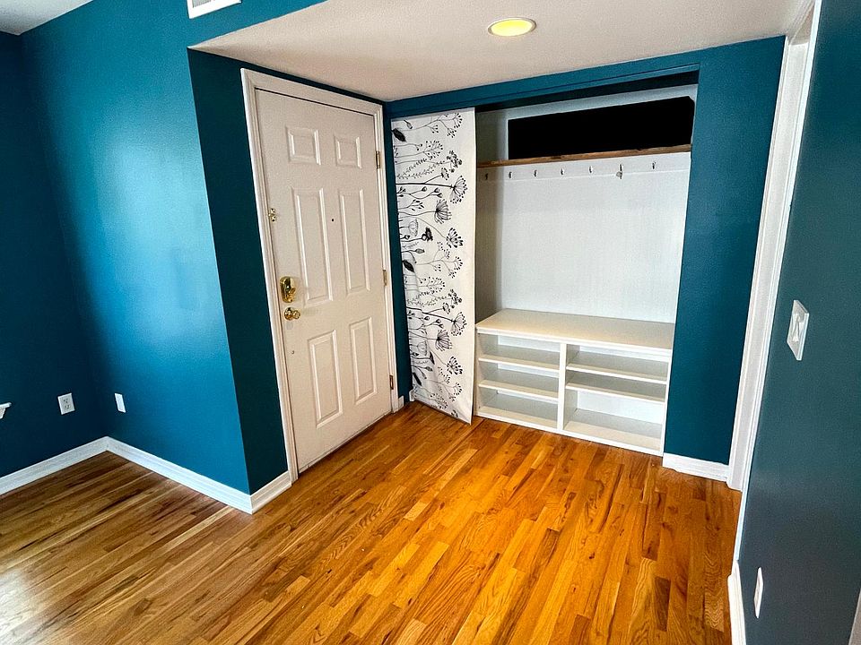 Entryway with plenty of storage for shoes, hooks, and cubbies.