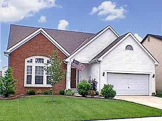 House sits on a beautiful lot with wonderful landscaping and an electric dos f